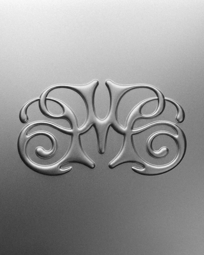 Mirrored chrome NEXUS monogram on void